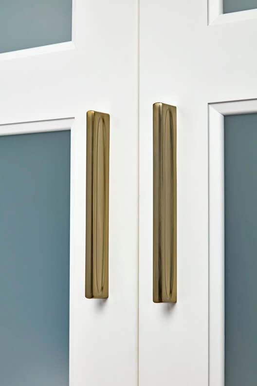 white cabinet with gold pull handles