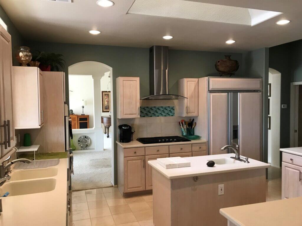 l shaped kitchen with white cabinets