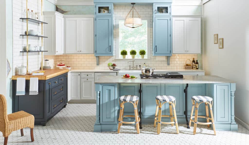 Light blue and white shaker kitchen cabinets with island