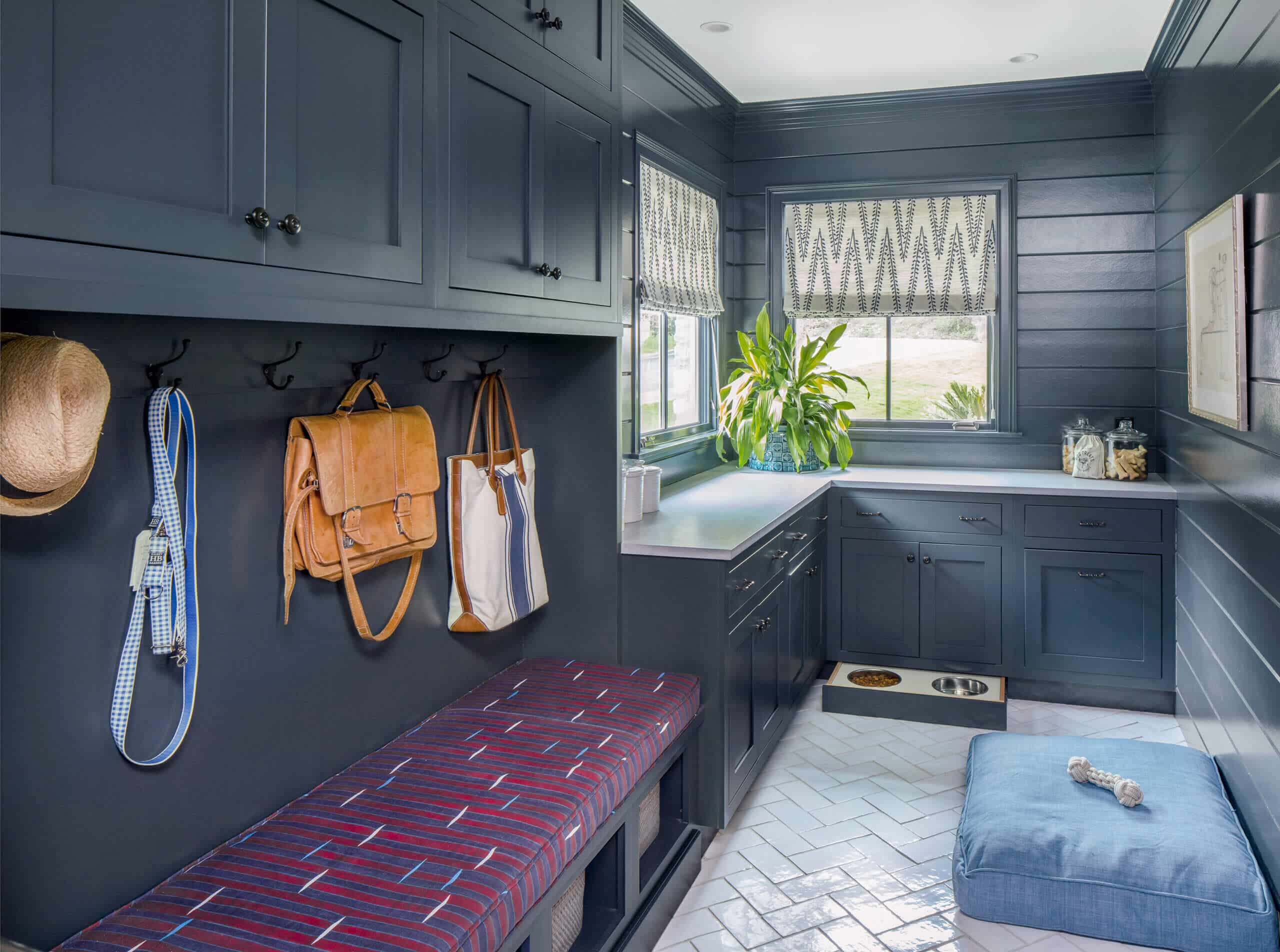 navy shaker laundry room cabinets with pet accessories 