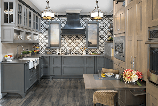 Grey kitchen cabinets with a pullout desk table